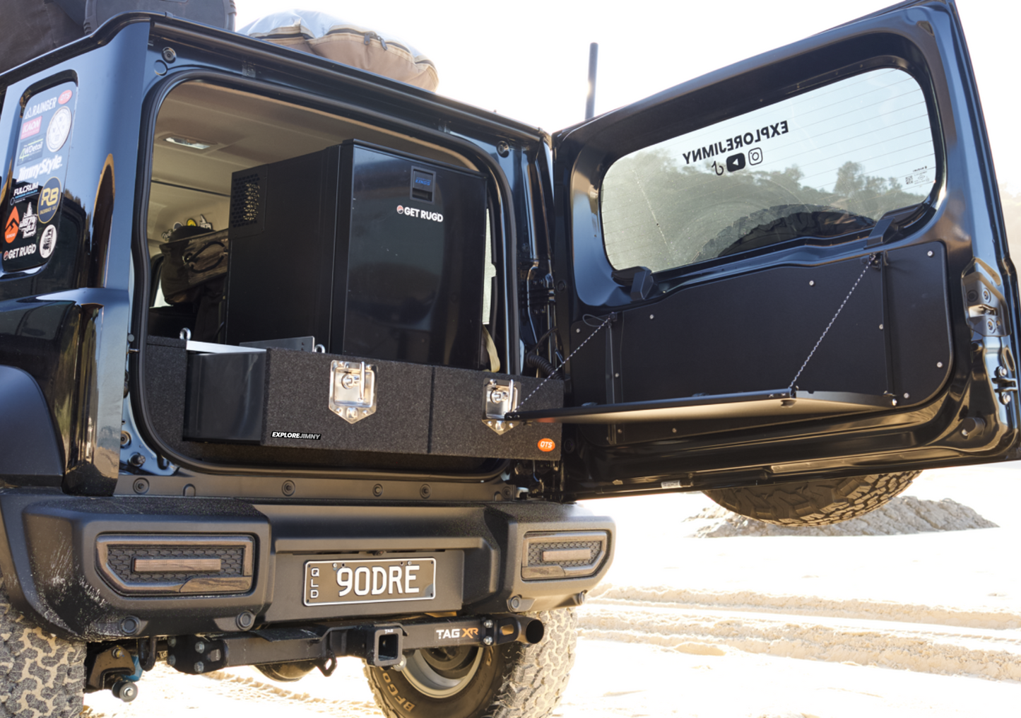 Suzuki Jimny XL Drawer System and Wing Kit installed in the open rear of a black Suzuki Jimny off-road vehicle