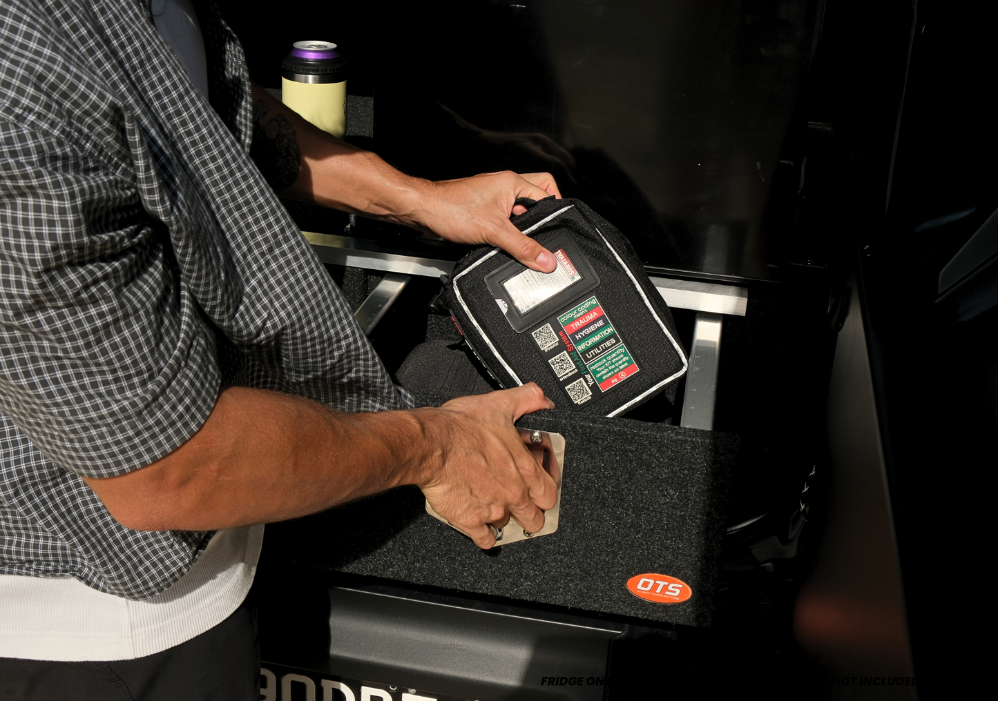 Person organizing tools in the jimny xl drawer system by EXPLOREJIMNY inside vehicle storage space