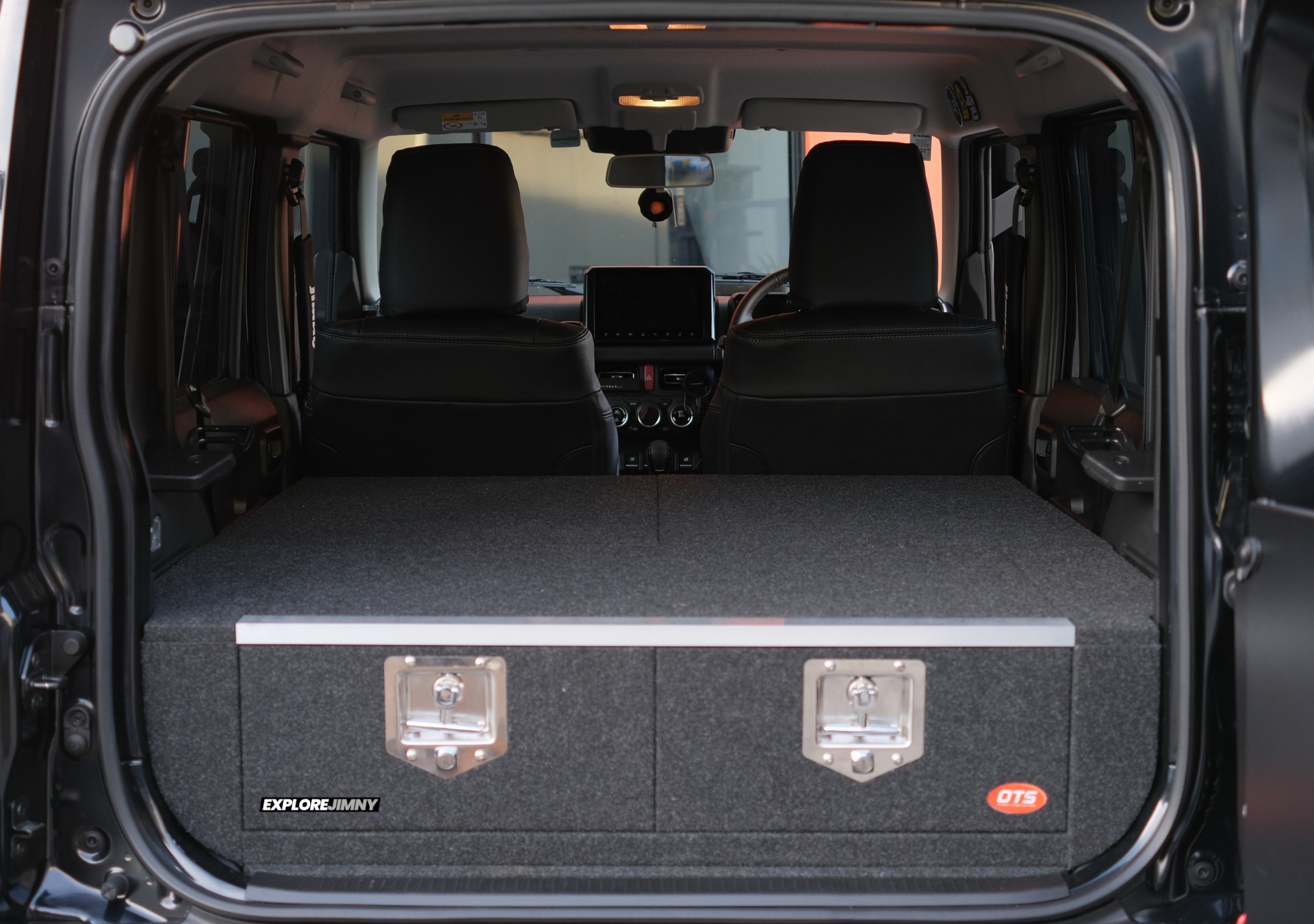 Explorejimny jimny xl drawer system installed in rear cargo area of Suzuki Jimny with black interior