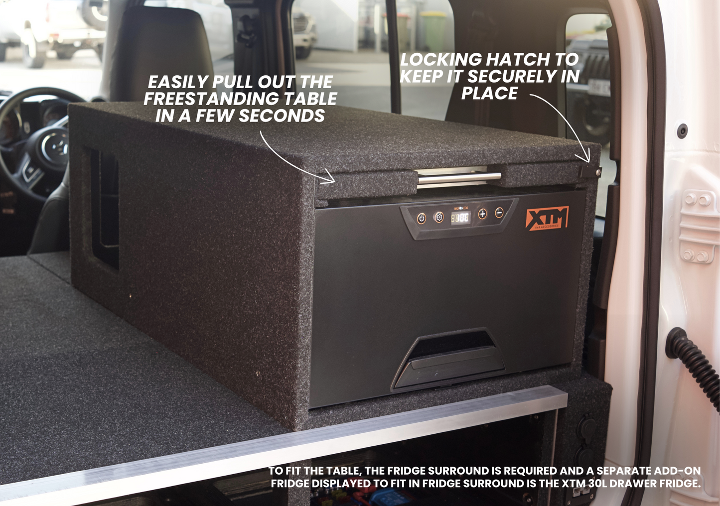 Suzuki Jimny XL pull-out table installed in vehicle cargo area with locking hatch and pull-out feature
